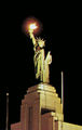 The Liberty National statue on the Liberty National Building at night